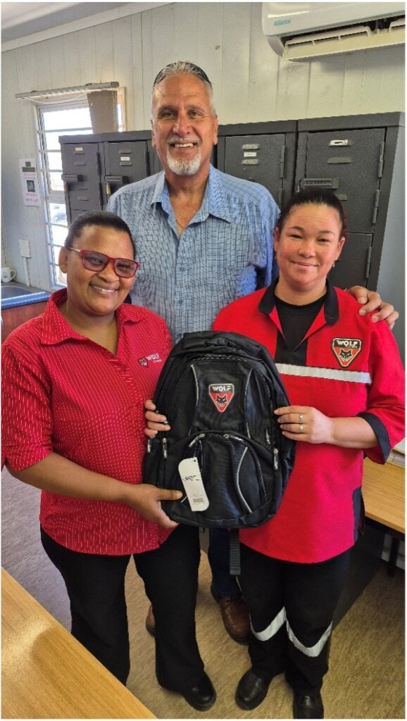 Christelle Ghall form the BSB Cleaning team being awarded with a Wolf Group backpack